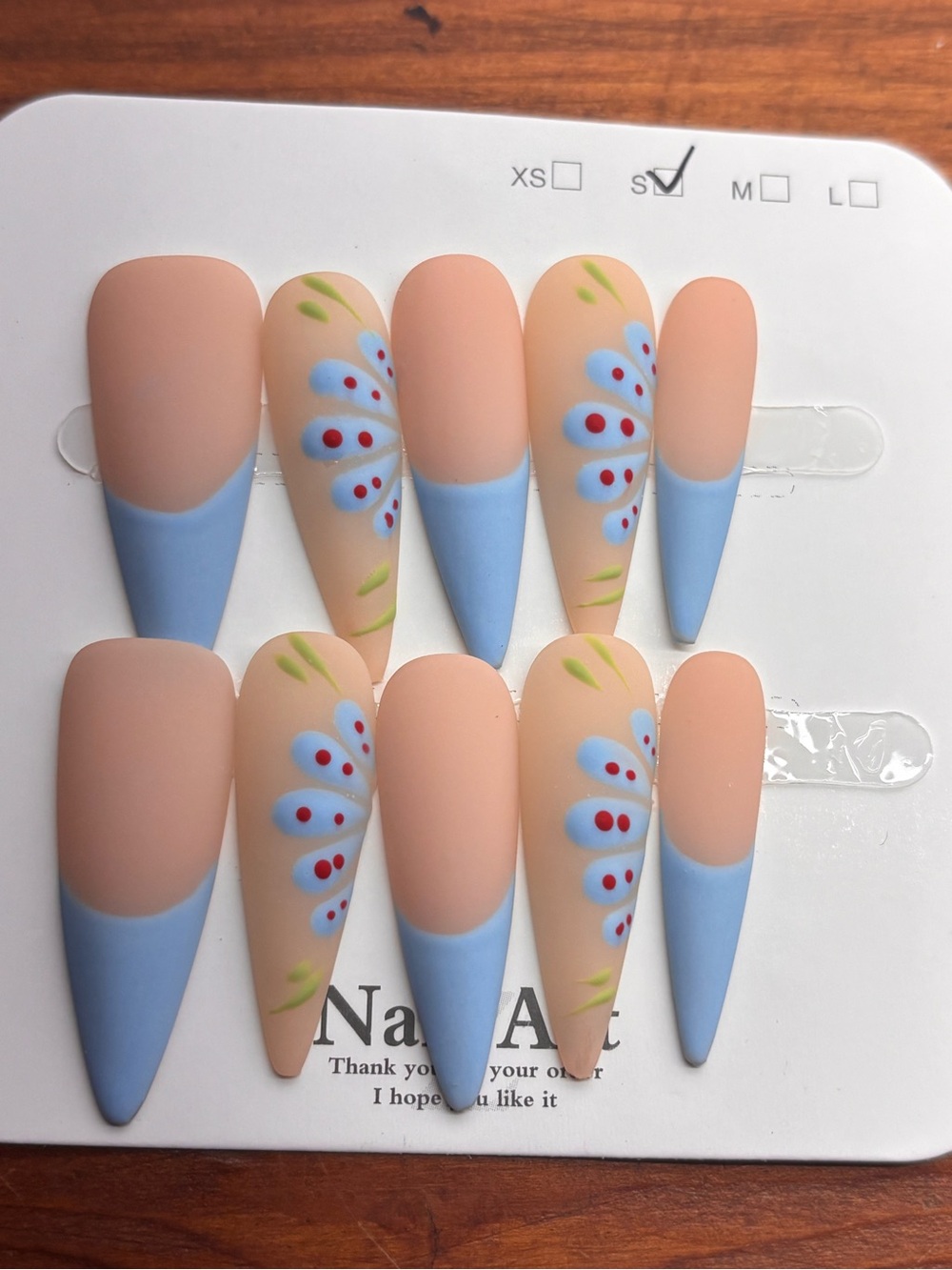 Peach Matte Stiletto Press-On Nails with Blue Floral Accent